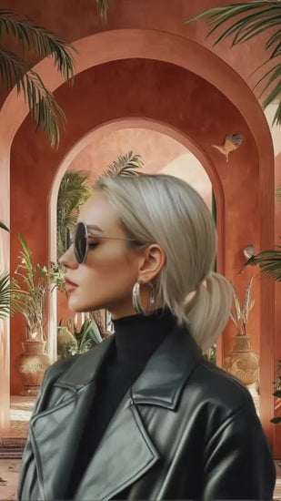 a a luxury outdoor courtyard speaks about how Realtors can upgrade their real estate content using the 120+ Luxury Real Estate AI Prompt Pack. Elegant visuals, soft lighting, and modern architecture set a high-end tone